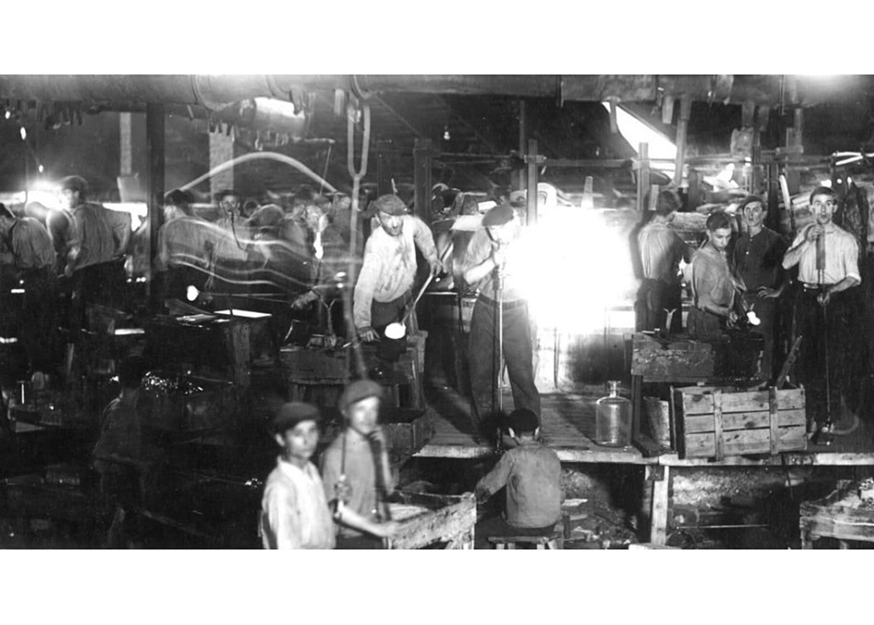 Masters and apprentices at the furnace, 1910
