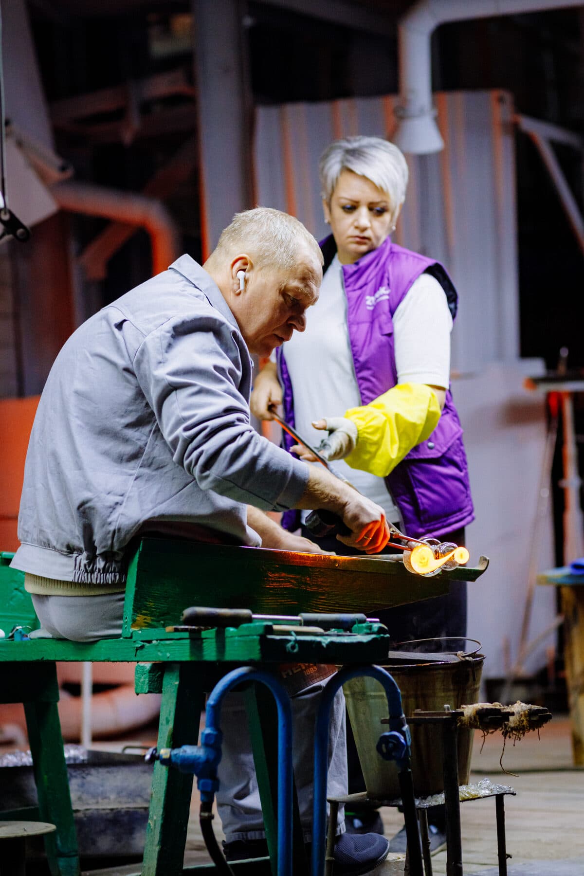 Shaping a piece by hand at the bench, present day